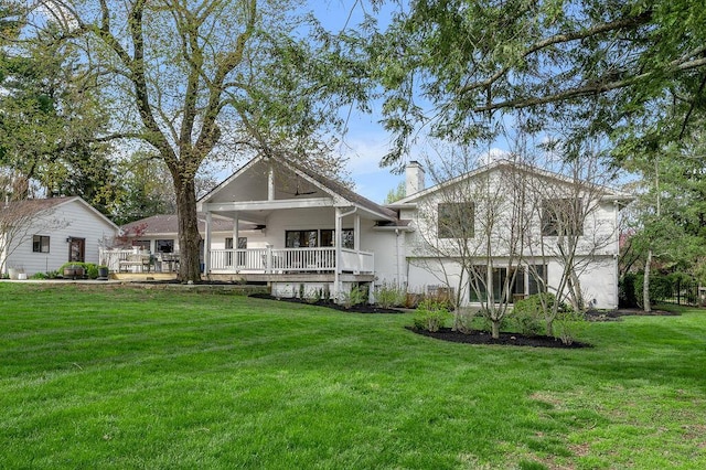 813 Westchester Dr, Lexington, KY 40502 - back of house featuring a lawn, a chimney, and a ceiling fan