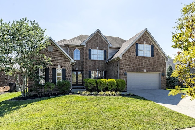 3864 Ormesby Pl, Lexington, KY 40515 - traditional-style home featuring french doors, a front lawn, concrete driveway, brick siding, and an attached garage