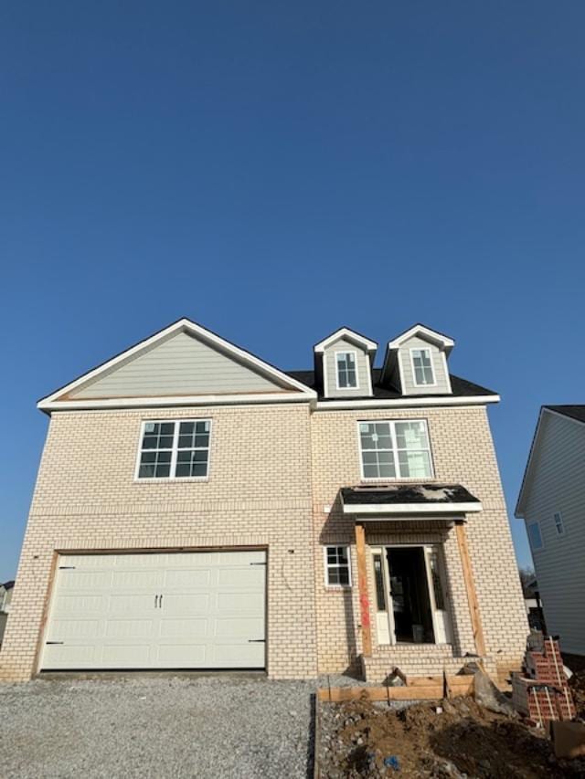 153 Village Park Dr, Georgetown, KY 40324 - traditional home with a garage, driveway, and brick siding