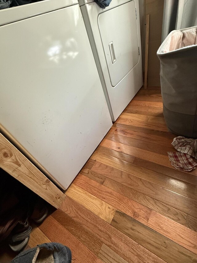 470 Cedar Bluff Rd, Monticello, KY 42633 - clothes washing area with washer / dryer, light wood-style floors, and laundry area