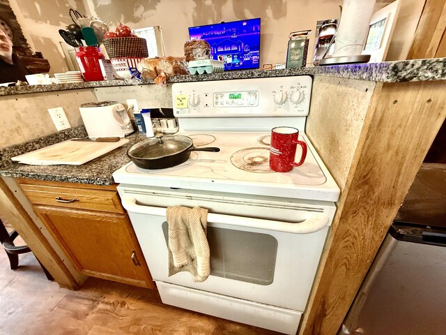 470 Cedar Bluff Rd, Monticello, KY 42633 - kitchen featuring brown cabinetry and electric stove