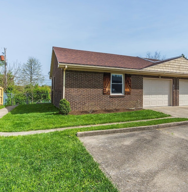 3241 Bowie Dr, Lexington, KY 40517 - view of front facade with brick siding, a front yard, a garage, and fence