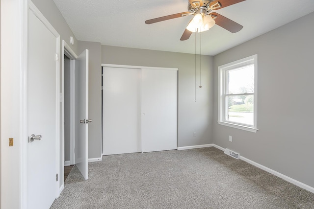 3241 Bowie Dr, Lexington, KY 40517 - unfurnished bedroom with visible vents, a ceiling fan, carpet floors, a closet, and baseboards
