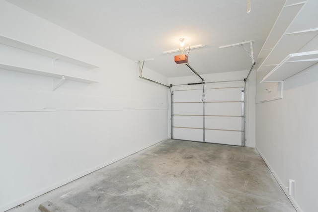 3241 Bowie Dr, Lexington, KY 40517 - garage with a garage door opener and baseboards