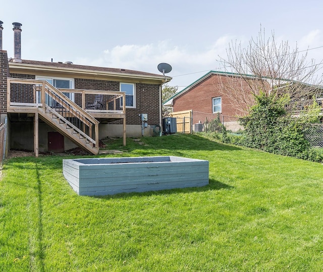 3241 Bowie Dr, Lexington, KY 40517 - back of house with stairs, fence, a yard, central air condition unit, and a deck