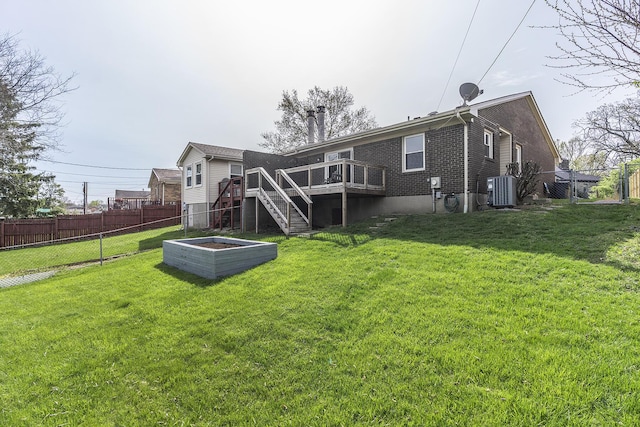3241 Bowie Dr, Lexington, KY 40517 - back of property featuring a wooden deck, a lawn, a fenced backyard, and stairway