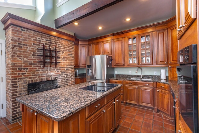 kitchen with glass insert cabinets, a sink, brown cabinets, and black appliances