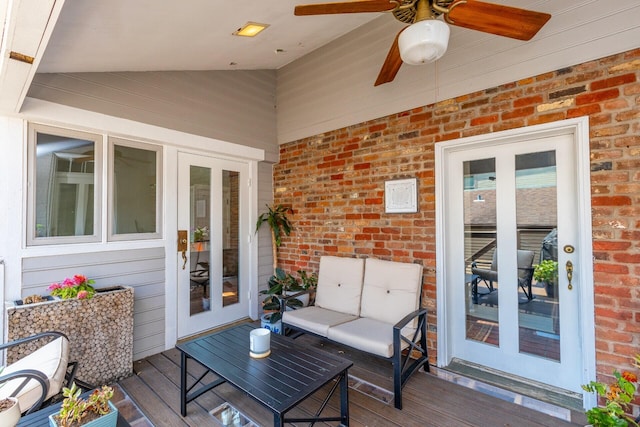 wooden terrace featuring a ceiling fan