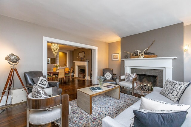 living room with wood finished floors and a fireplace