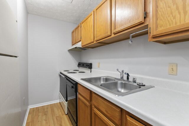 1081 S Broadway Unit 104, Lexington, KY 40504 - kitchen featuring a sink, light wood-type flooring, black dishwasher, range with electric stovetop, and light countertops