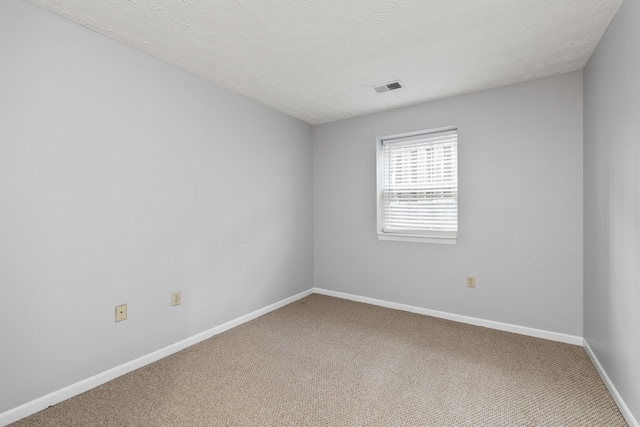 1081 S Broadway Unit 104, Lexington, KY 40504 - carpeted empty room with visible vents, baseboards, and a textured ceiling