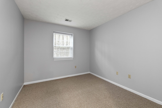 1081 S Broadway Unit 104, Lexington, KY 40504 - unfurnished room with visible vents, baseboards, carpet flooring, and a textured ceiling