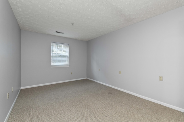 1081 S Broadway Unit 104, Lexington, KY 40504 - carpeted empty room featuring a textured ceiling, visible vents, and baseboards