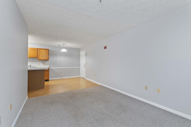 1081 S Broadway Unit 104, Lexington, KY 40504 - interior space featuring light colored carpet, baseboards, and a textured ceiling
