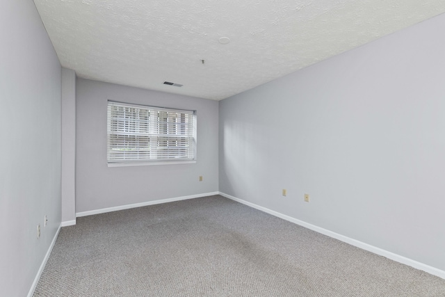 1081 S Broadway Unit 104, Lexington, KY 40504 - carpeted spare room featuring baseboards, visible vents, and a textured ceiling