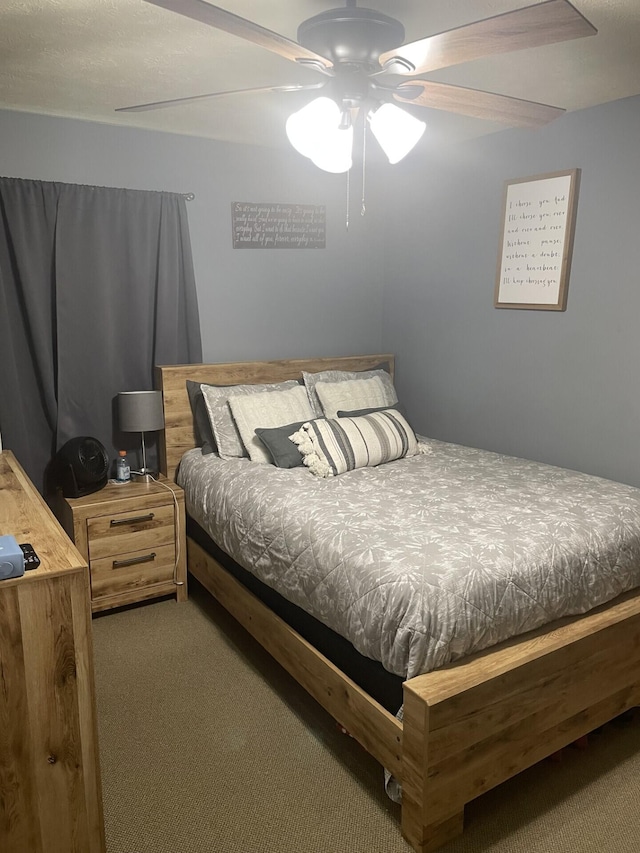 bedroom featuring a ceiling fan and carpet floors