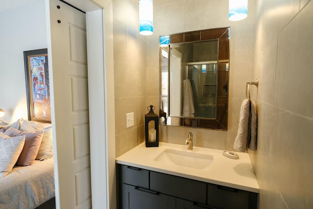 ensuite bathroom with a shower stall, ensuite bathroom, and vanity