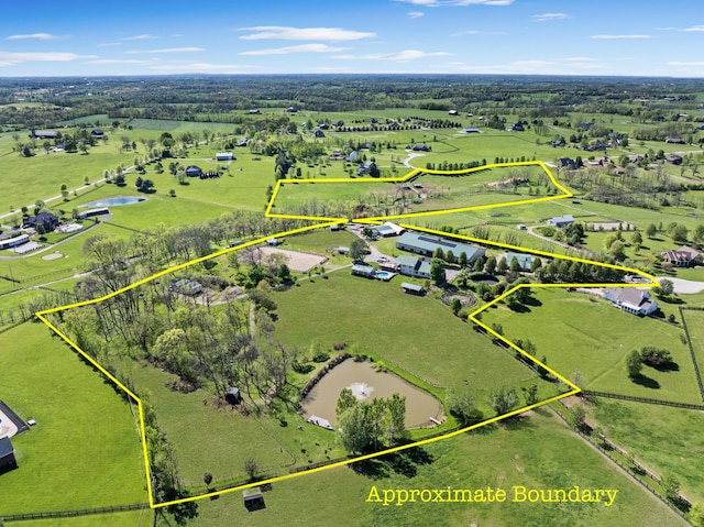 drone / aerial view featuring a water view and a rural view
