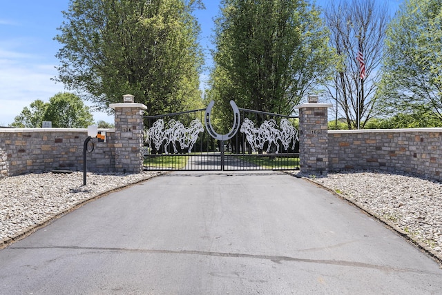 view of gate with fence