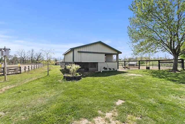 exterior space with a yard, an outbuilding, and an exterior structure