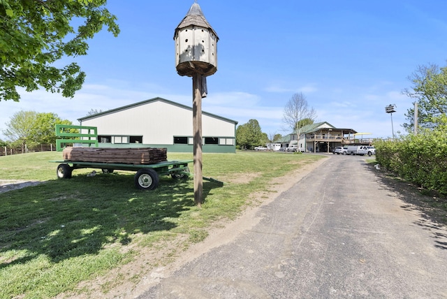 view of road with aphalt driveway