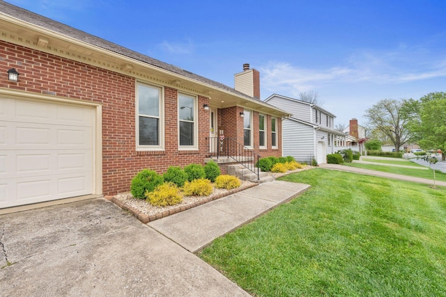 view of front of home with a front lawn, brick siding, a garage, a chimney, and driveway