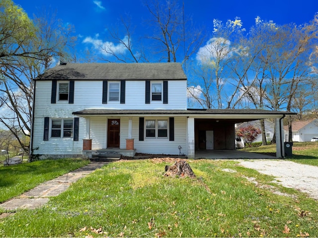 1312 Roosevelt St, Corbin, KY 40701 - traditional home featuring a porch, an attached carport, a front yard, and dirt driveway