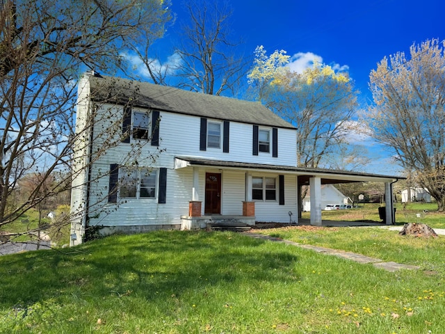 1312 Roosevelt St, Corbin, KY 40701 - view of front of home featuring an attached carport, roof with shingles, covered porch, and a front yard