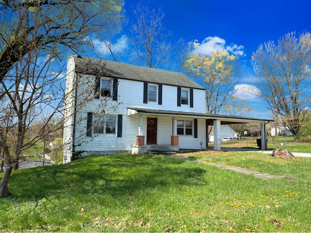 1312 Roosevelt St, Corbin, KY 40701 - view of front facade featuring covered porch, an attached carport, and a front yard