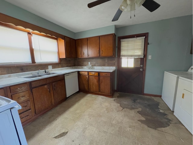 1312 Roosevelt St, Corbin, KY 40701 - kitchen with washer and clothes dryer, stove, dishwasher, and brown cabinets