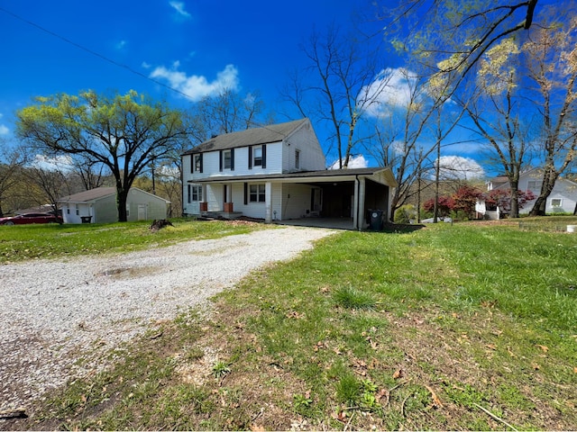 1312 Roosevelt St, Corbin, KY 40701 - view of front facade featuring dirt driveway, a carport, and a front yard