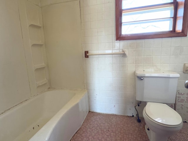 1312 Roosevelt St, Corbin, KY 40701 - full bathroom featuring a bathing tub, toilet, tile walls, and a shower
