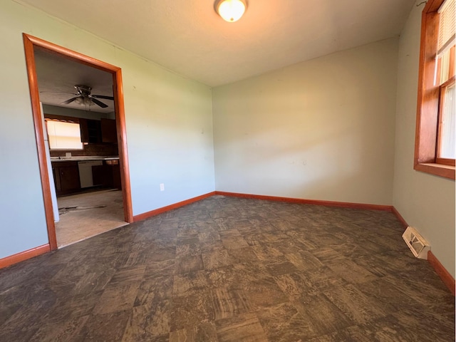 1312 Roosevelt St, Corbin, KY 40701 - spare room featuring visible vents, a ceiling fan, and baseboards