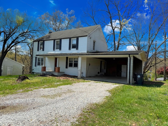 1312 Roosevelt St, Corbin, KY 40701 - view of front of property featuring a front lawn, a shingled roof, a porch, driveway, and a carport