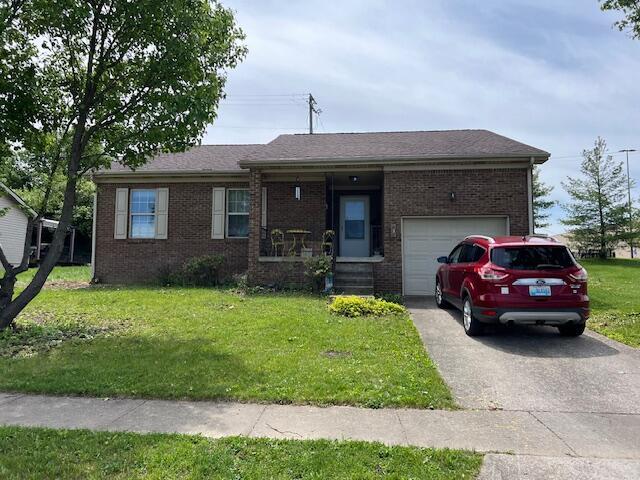 130 Fox Harbor Dr, Danville, KY 40422 - ranch-style house featuring brick siding, aphalt driveway, a front yard, and a garage