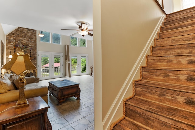 832 Cliffs Edge Rd, East Bernstadt, KY 40729 - stairs with a high ceiling, a ceiling fan, and french doors