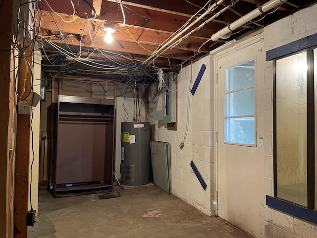 below grade area featuring water heater