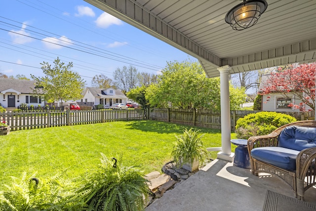 view of yard with a residential view and a fenced backyard