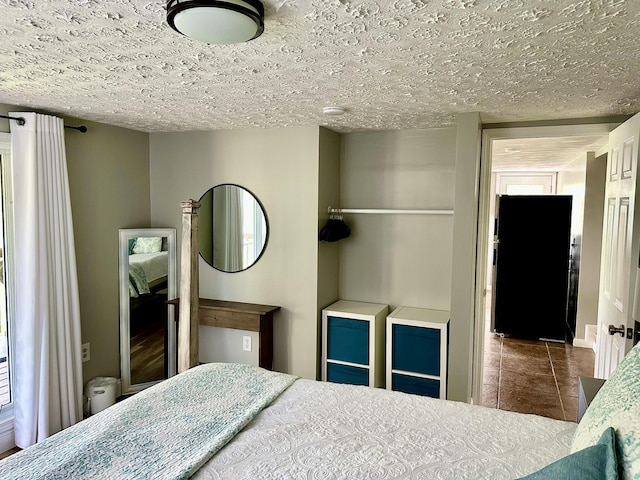 641 Webster Spradlin Rd, Monticello, KY 42633 - bedroom with tile patterned flooring and a textured ceiling