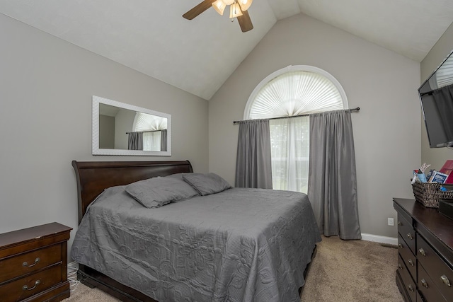 bedroom with baseboards, a ceiling fan, lofted ceiling, and light colored carpet