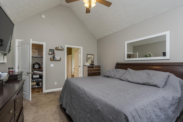 carpeted bedroom with baseboards, high vaulted ceiling, ceiling fan, and ensuite bath