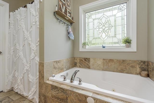 bathroom with a garden tub