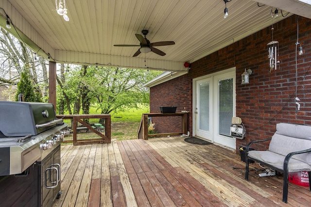 wooden terrace featuring a ceiling fan