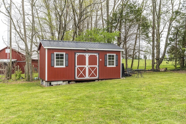 view of shed with fence