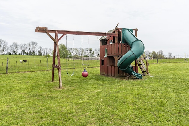view of play area with fence and a yard