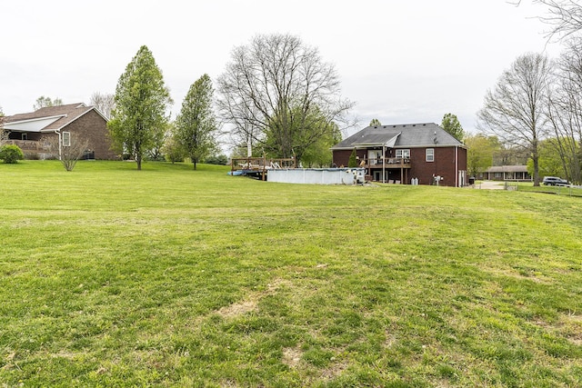 view of yard with a wooden deck