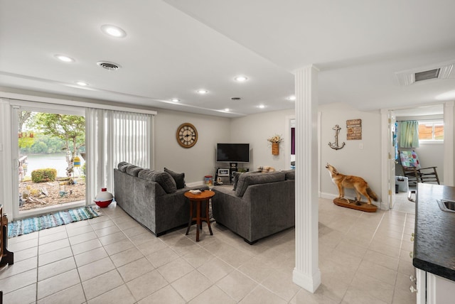 living room featuring visible vents, recessed lighting, baseboards, and light tile patterned floors
