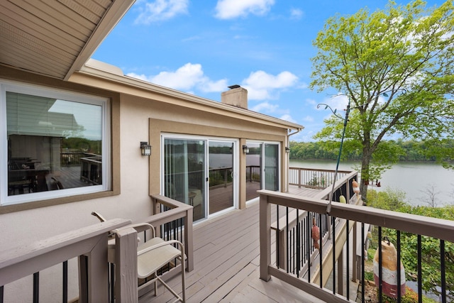 deck featuring a water view