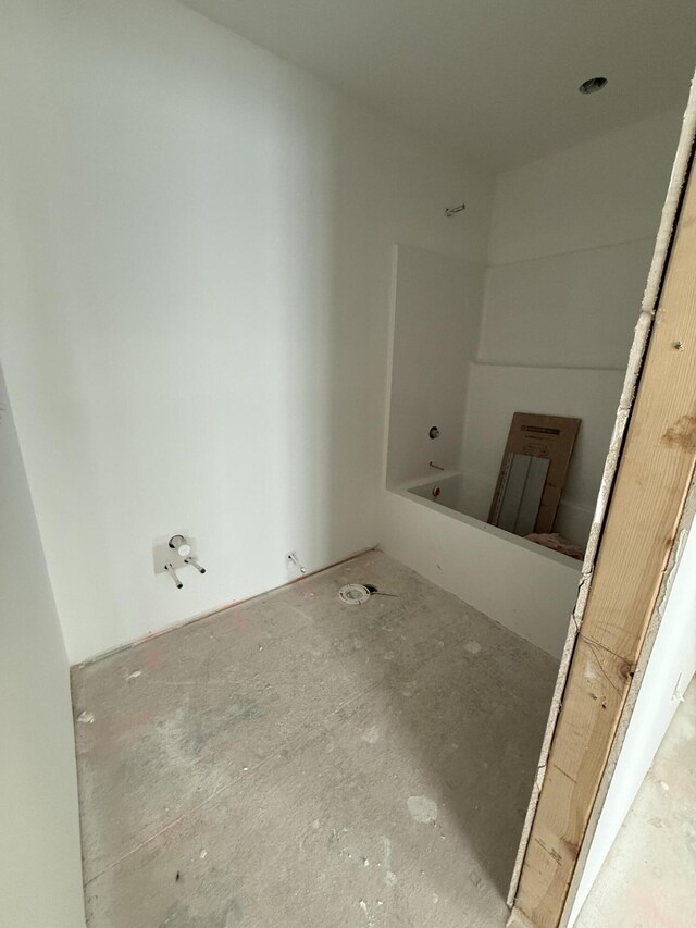 bathroom with a tub to relax in