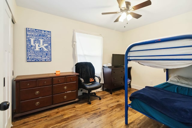 bedroom with wood finished floors and a ceiling fan